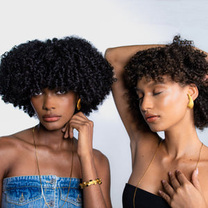 Vintage 1970s Swoosh Earrings on two beautiful black female models